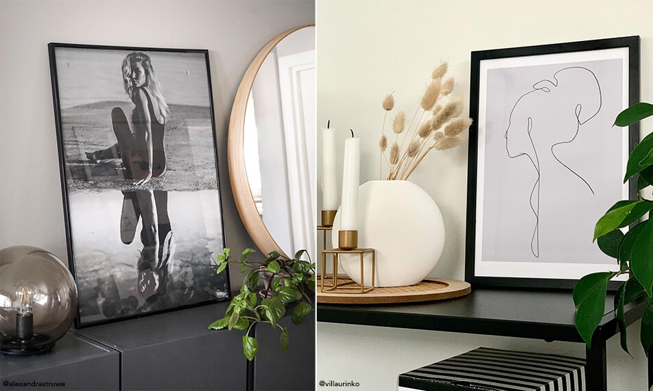 Κομψός εσωτερικός σχεδιασμός με μαύρους πίνακες και πράσινα φυτά